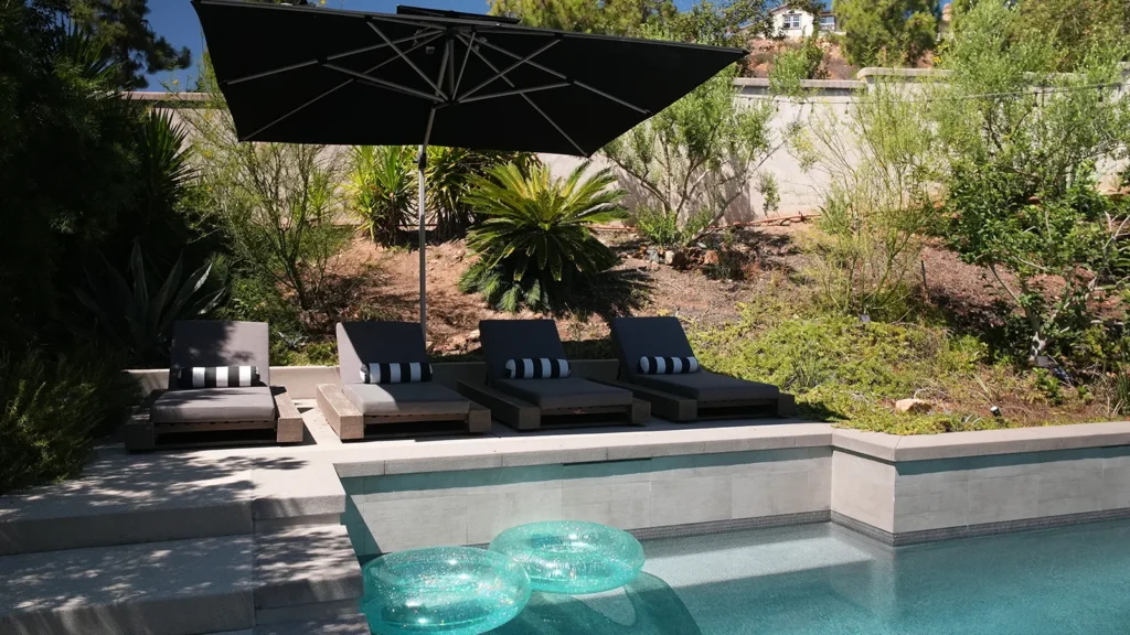 San Marcos backyard with custom pool, spa, outdoor kitchen and fire pit